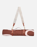 Hercule Studio Bari Choco printed nomad bundle including the brown graphic Archy mat and a mat carrying strap for sport mats, elegant duo for Pilates and fitness on the move, French craftsmanship, packshot