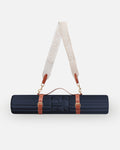 Hercule Studio navy blue nomad bundle with the design Archy mat and a mat carrying strap for sport mats, lightweight and elegant bundle for Pilates and fitness on the move, made in France, packshot