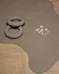 Hercule Studio Mar Greige yoga mat in lifestyle session, natural beige-grey color for a zen yoga session, high grip PVC-free natural rubber