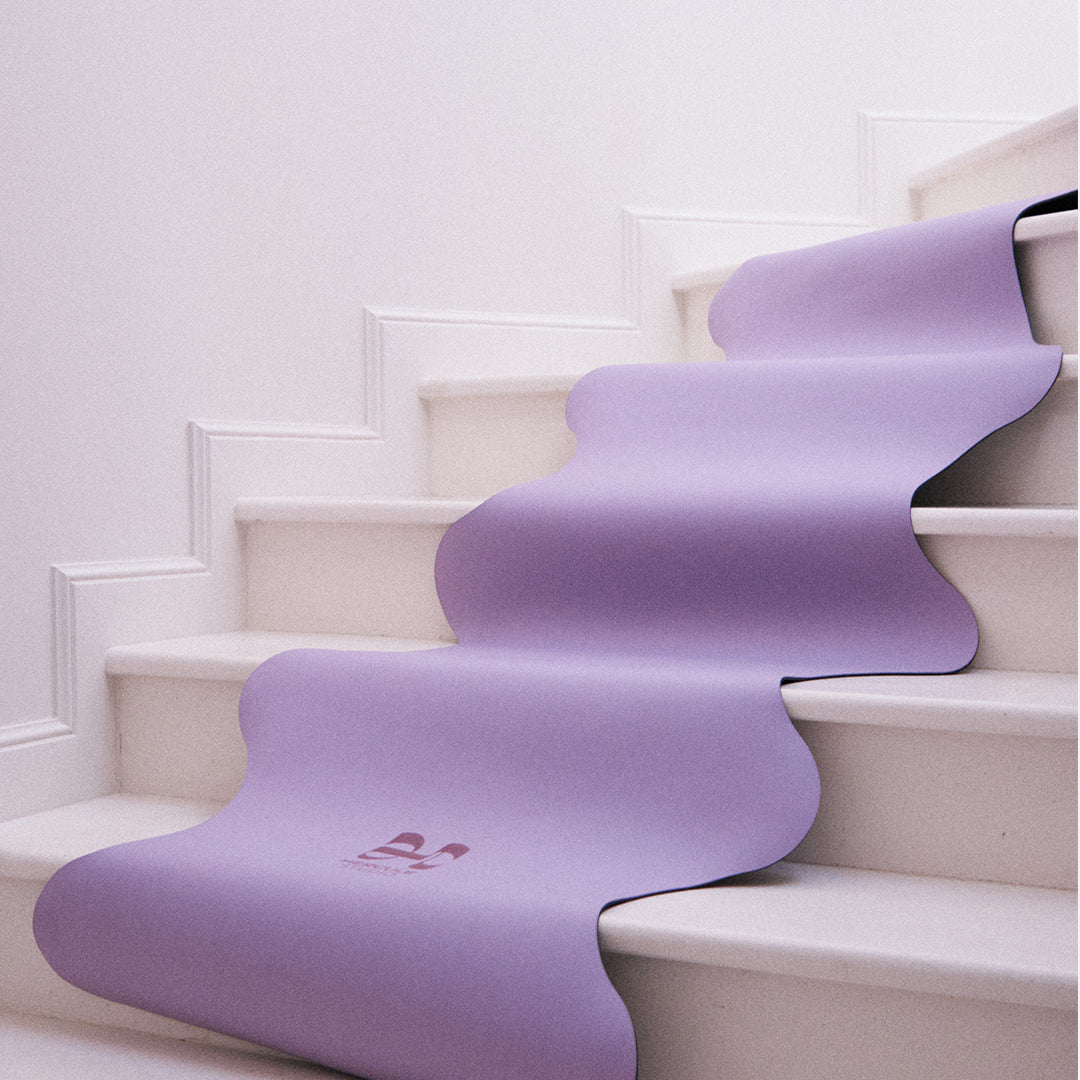 Hercule Studio Mar Lavender Yoga Mat in a lifestyle setting, featuring a soft purple hue perfect for yoga and meditation sessions, made from PVC-free natural rubber