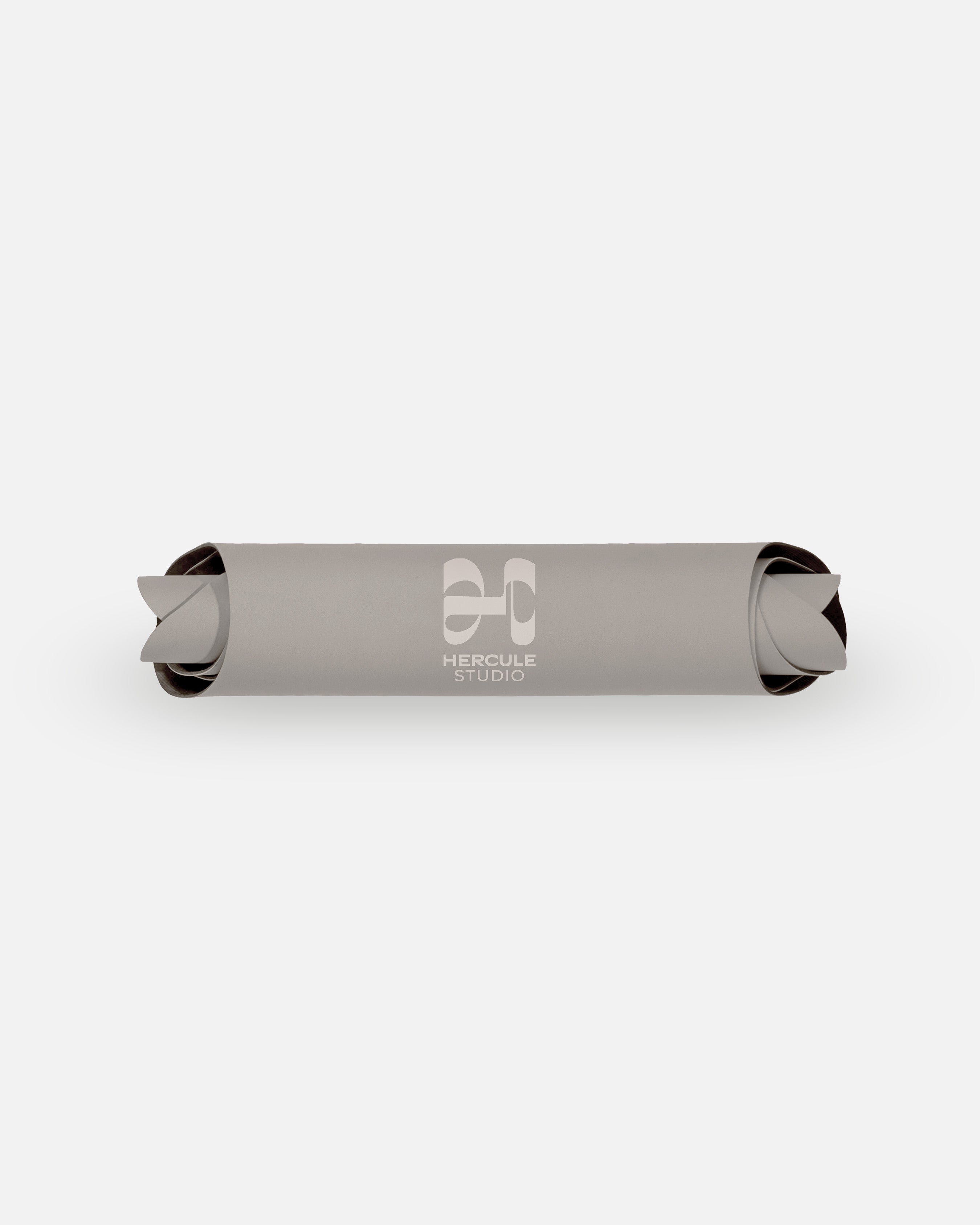 Packshot of the rolled Hercule Studio Greige mat, durable natural material, strong non-slip grip, modern wavy design