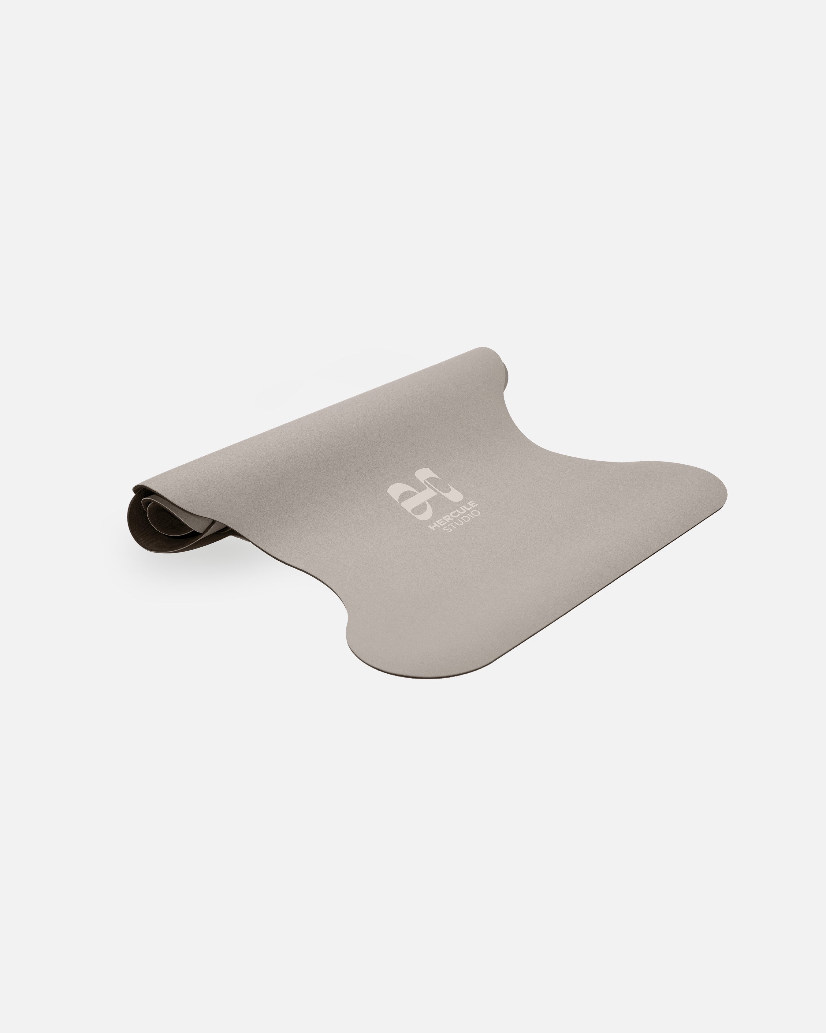 Half-rolled view of the Hercule Studio Greige yoga mat, PVC-free, eco-friendly, comfort and performance for all postures