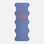 Hercule Studio Thomas Lélu quote yoga mat unrolled, blue background with red message, machine-washable suede, limited edition