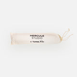 Hercule Studio x Thomas Lélu white fabric dust bag, protective cover with black logo for transport and storage of the Mar yoga mat