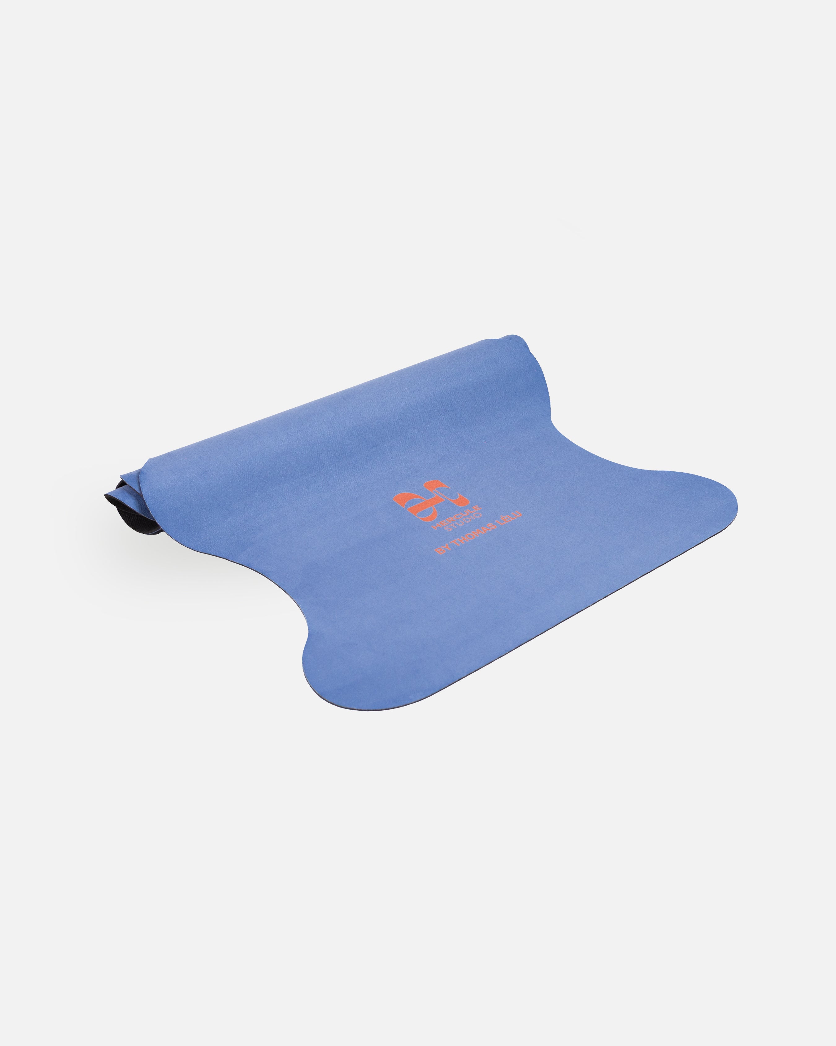 Half-rolled view of the Hercule Studio Thomas Lélu design yoga mat, limited edition quote mat, durable suede material