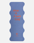 Hercule Studio Thomas Lélu quote yoga mat unrolled, blue background with red message, machine-washable suede, limited edition