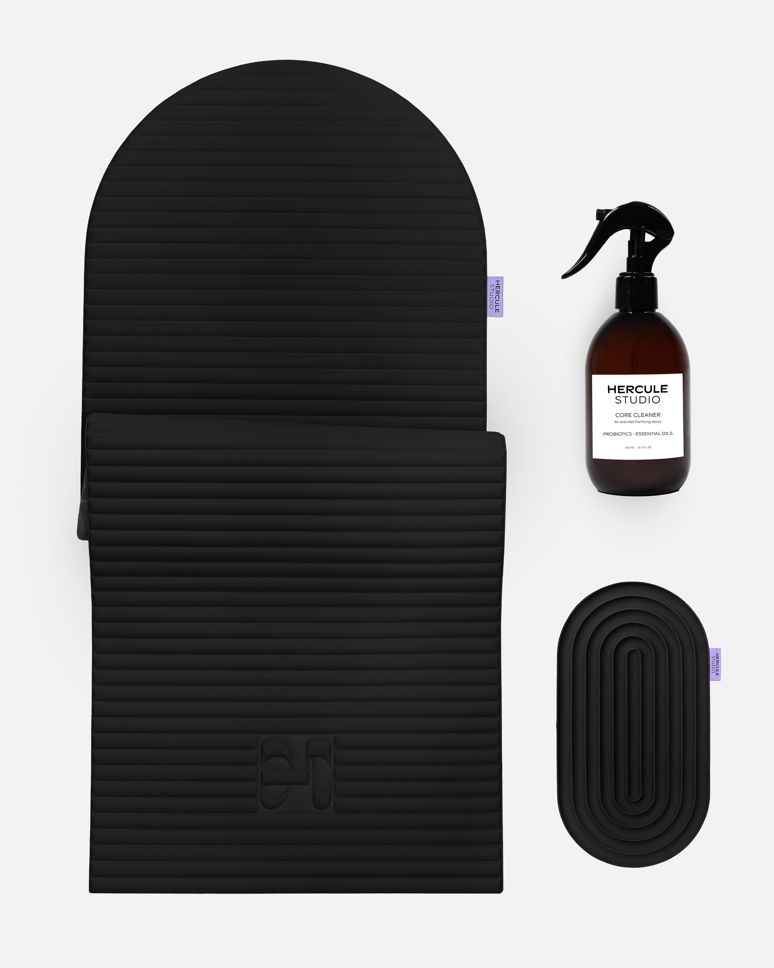 Hercule Studio Midnight Black essential sport bundle bringing together the premium Archy mat, the ergonomic Galé comfort pad and the sanitizing spray for yoga and fitness mats, complete Pilates Reformer solution Made in France, packshot view