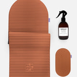 Hercule Studio terracotta essential bundle including the Archy arch-shaped sport mat, the Galé 3-in-1 comfort pad for knees and elbows and the sanitizing spray, durable Made in France Pilates and fitness bundle, packshot of grouped products